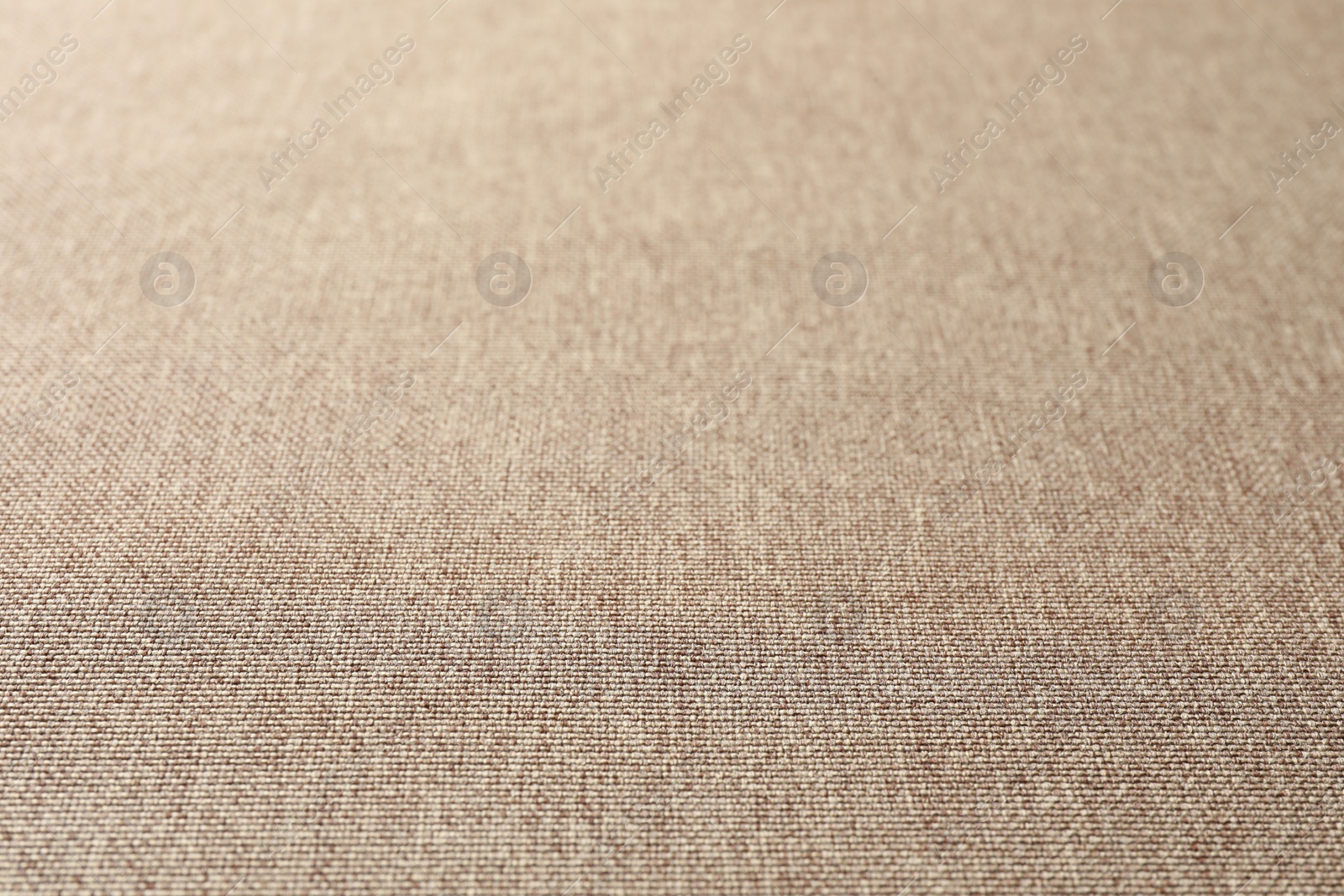 Photo of Texture of light brown fabric as background, closeup