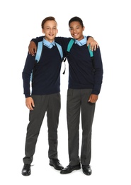 Teenagers in stylish school uniform on white background