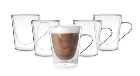 Image of Empty glass cups and one with aromatic coffee on white background. Banner design