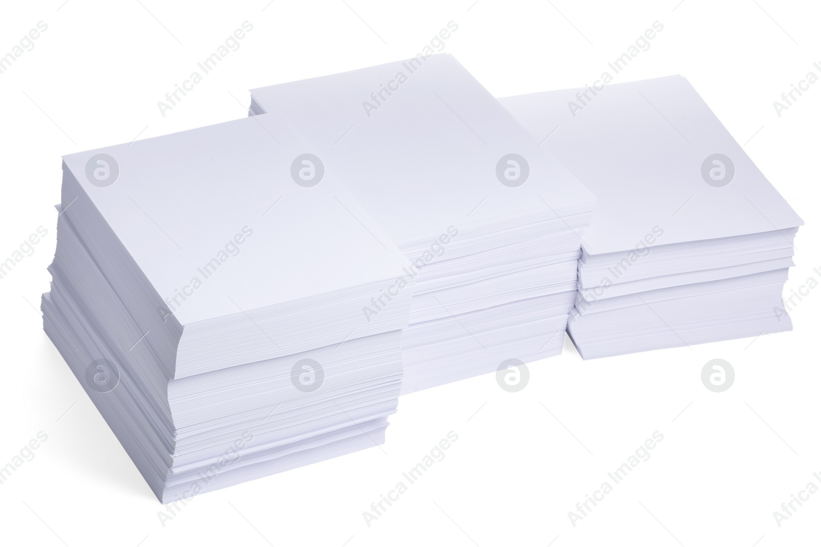 Photo of Stacks of paper sheets on white background