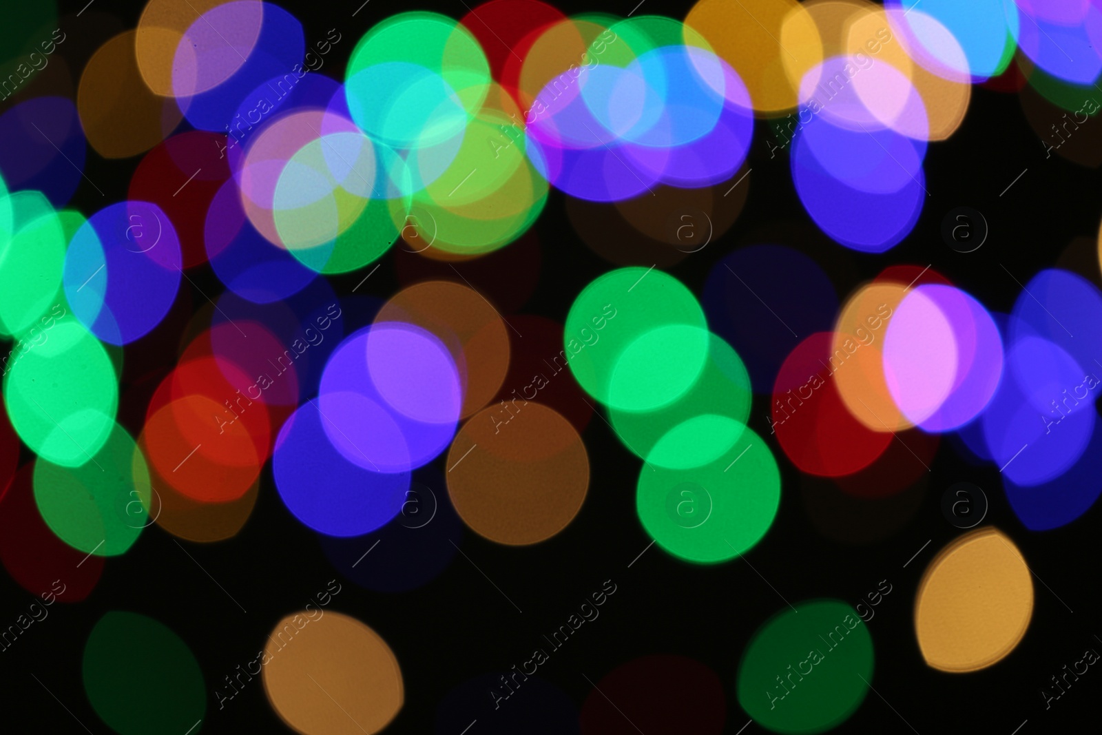 Photo of Beautiful colorful lights on dark background. Bokeh effect