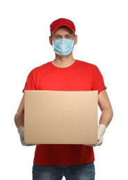 Photo of Courier in protective mask and gloves holding cardboard box on white background. Delivery service during coronavirus quarantine
