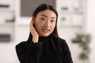 Portrait of smiling confident businesswoman in office