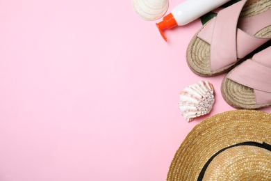 Photo of Flat lay composition with beach objects on pink background. Space for text