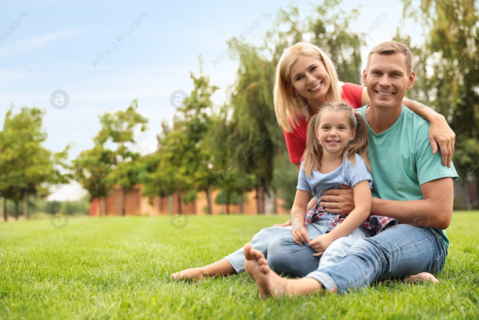 Photo of Happy family spending time together in park on sunny summer day