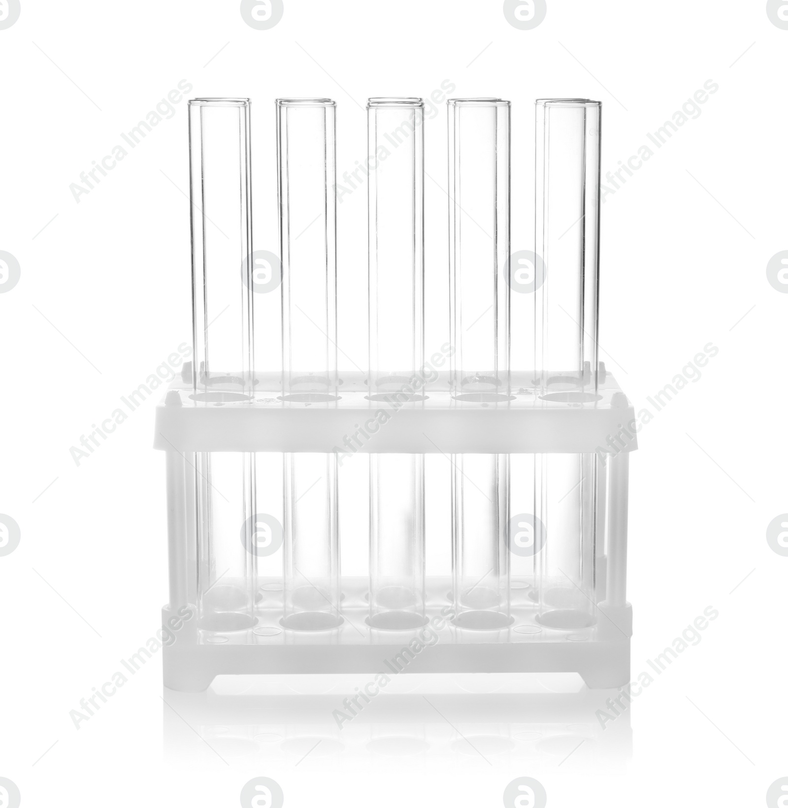 Photo of Holder with empty test tubes on white background. Laboratory glassware