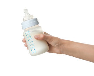 Woman holding baby bottle with milk on white background