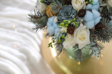 Photo of Beautiful wedding winter bouquet on table, closeup. Space for text
