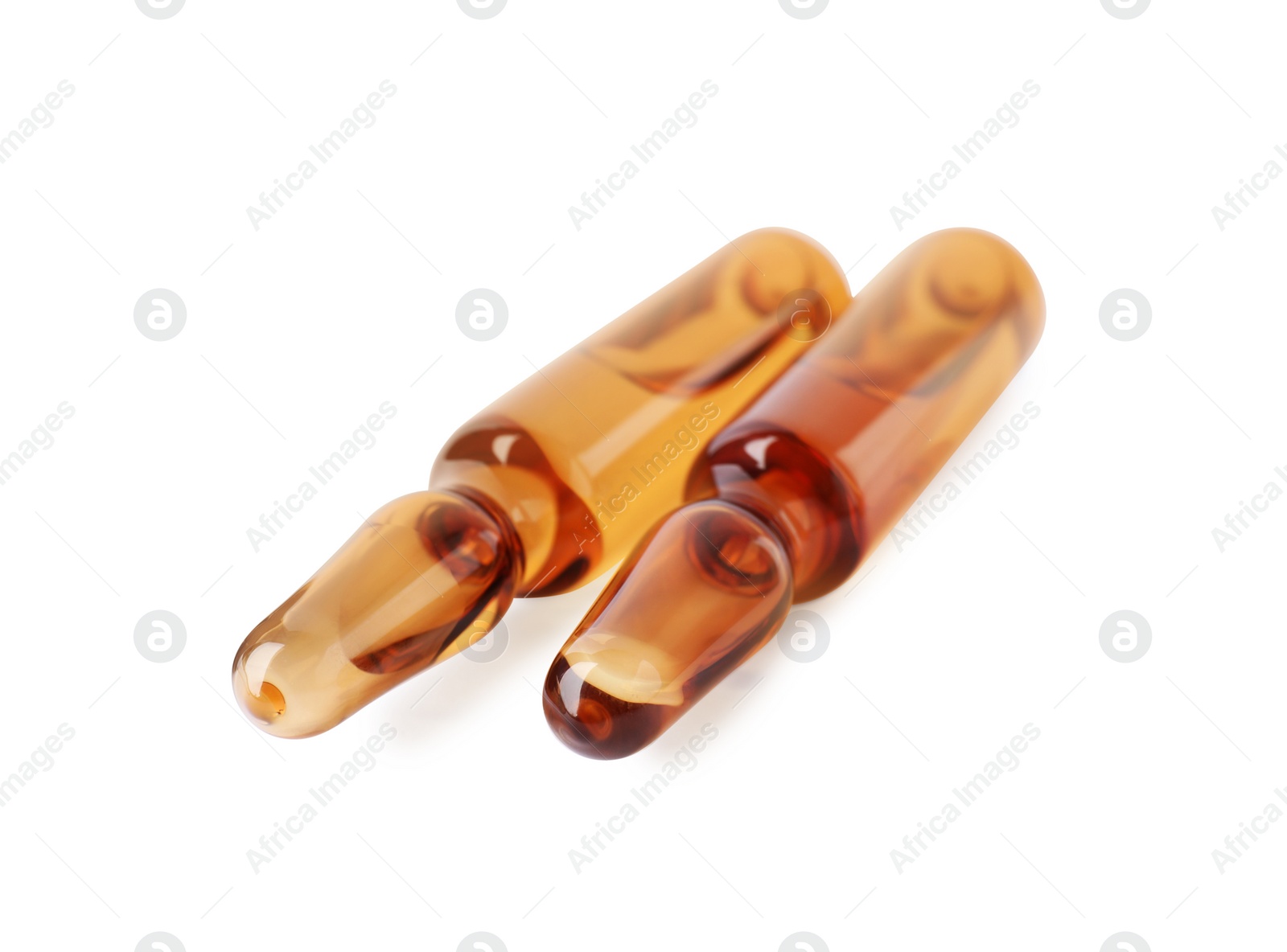 Photo of Brown pharmaceutical ampoules with medication on white background