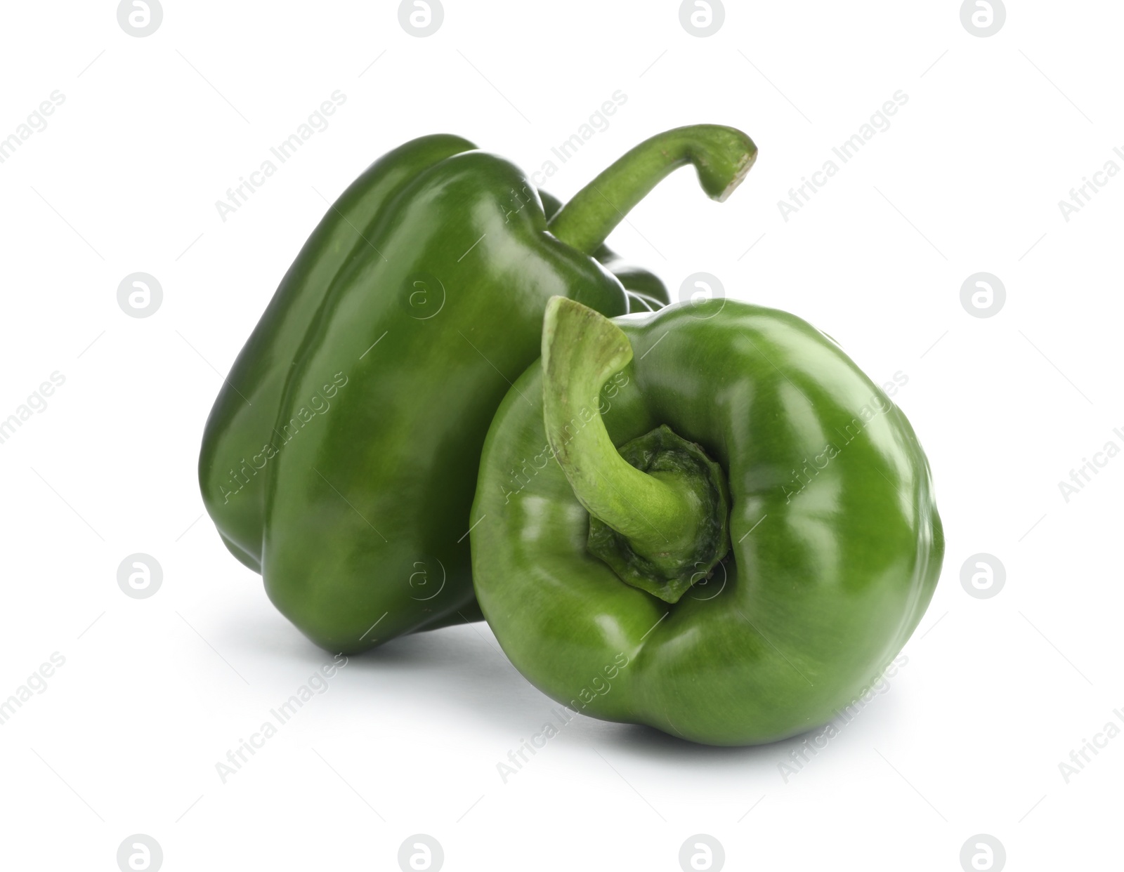 Photo of Ripe green bell peppers on white background