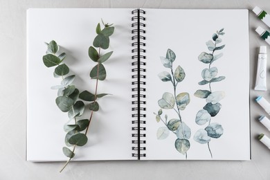 Photo of Flat lay composition with beautiful drawing of eucalyptus branches on white table