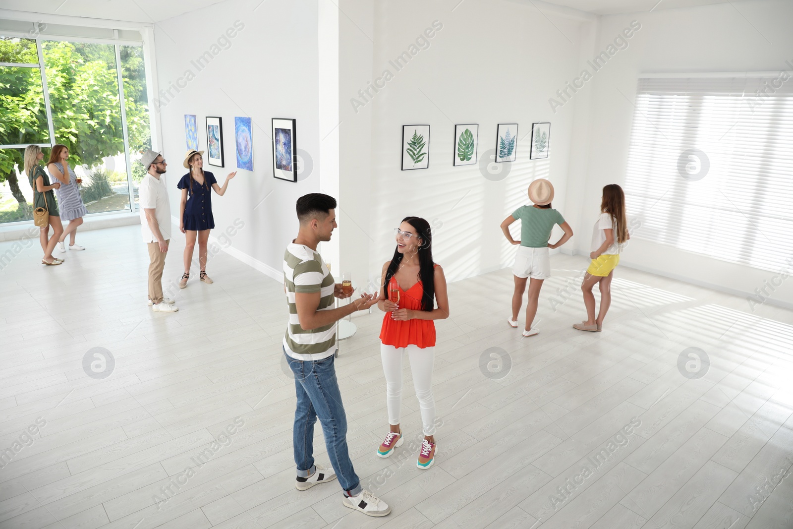 Photo of Group of people at exhibition in art gallery