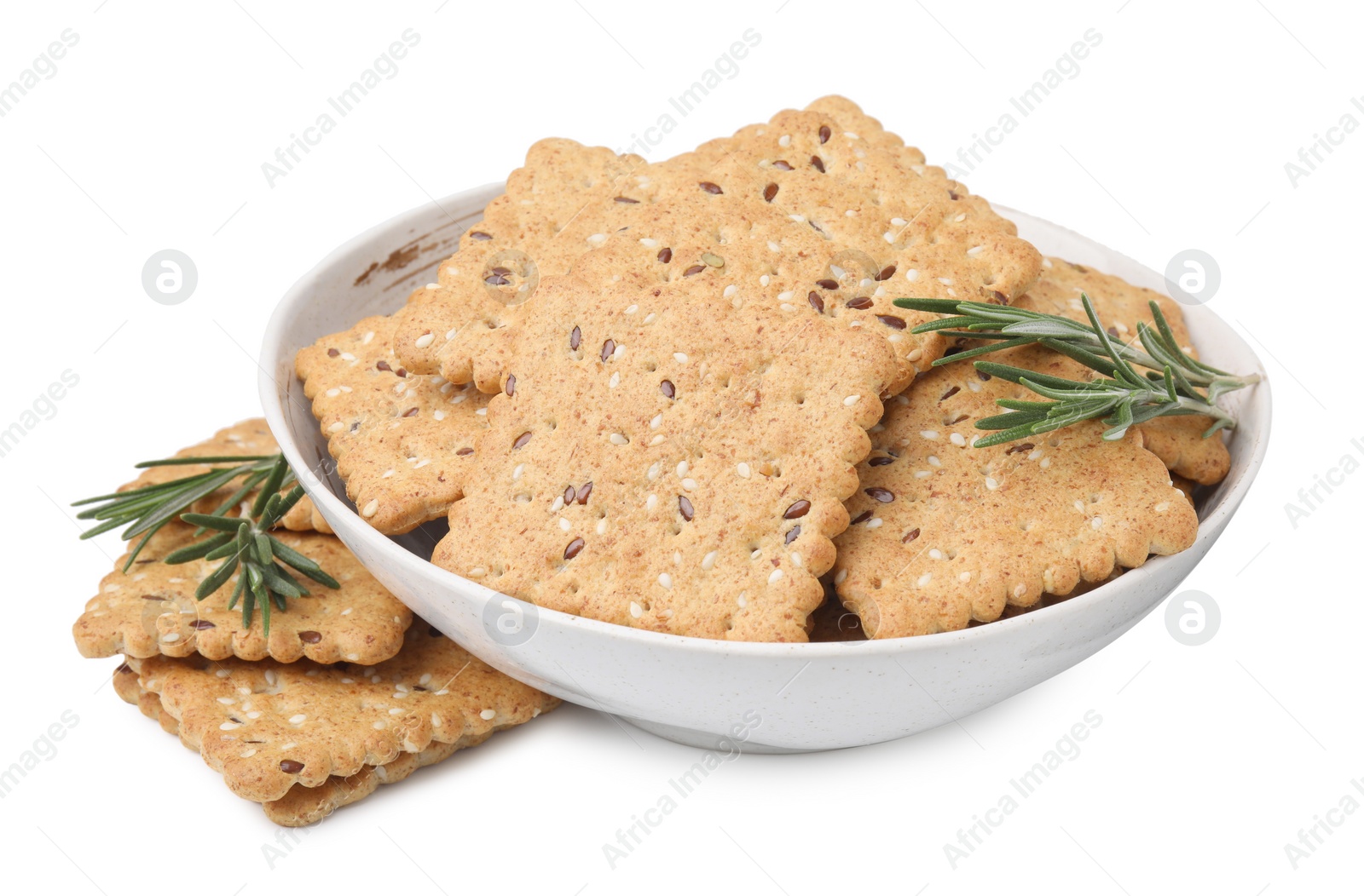 Photo of Cereal crackers with flax, sesame seeds and rosemary in bowl isolated on white