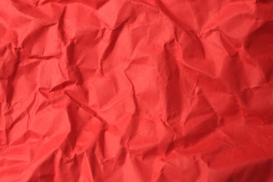 Photo of Sheet of crumpled red paper as background, top view