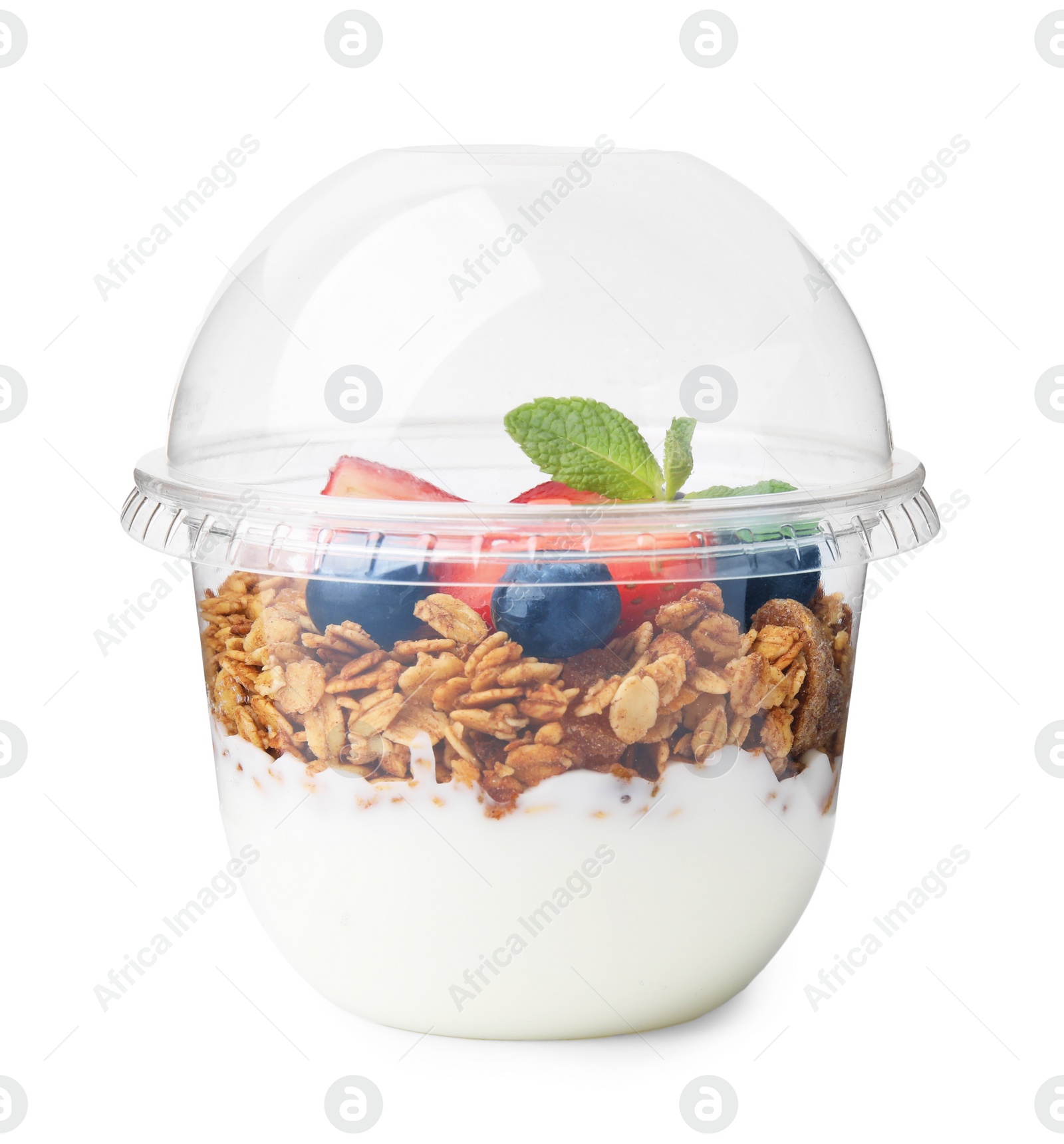 Photo of Tasty granola with berries and yogurt in plastic cup isolated on white