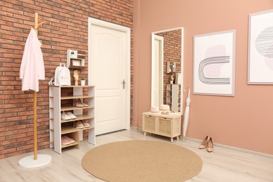 Modern hallway interior with mirror and wooden furniture