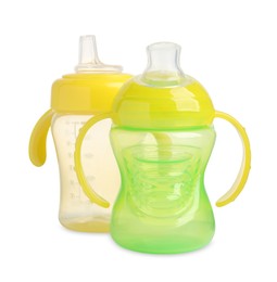 Photo of Two empty feeding bottles for infant formula on white background