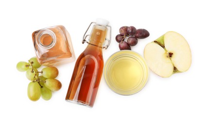 Different types of vinegar and ingredients isolated on white, top view