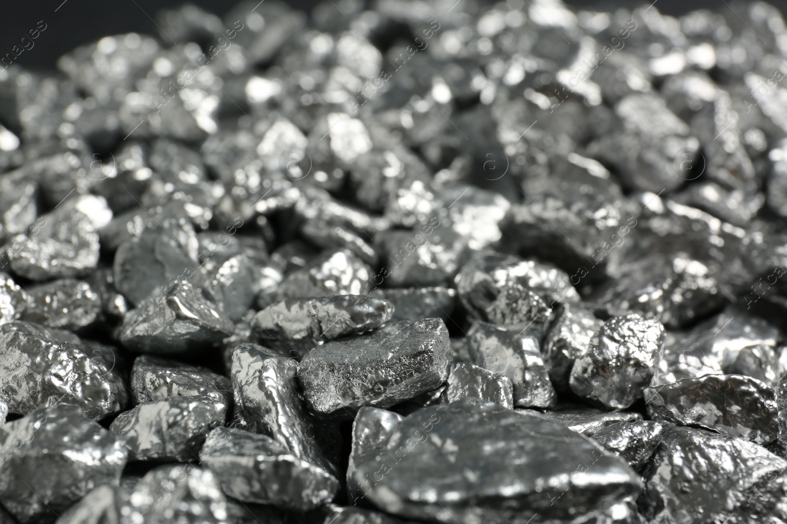 Photo of Many shiny silver nuggets as background, closeup
