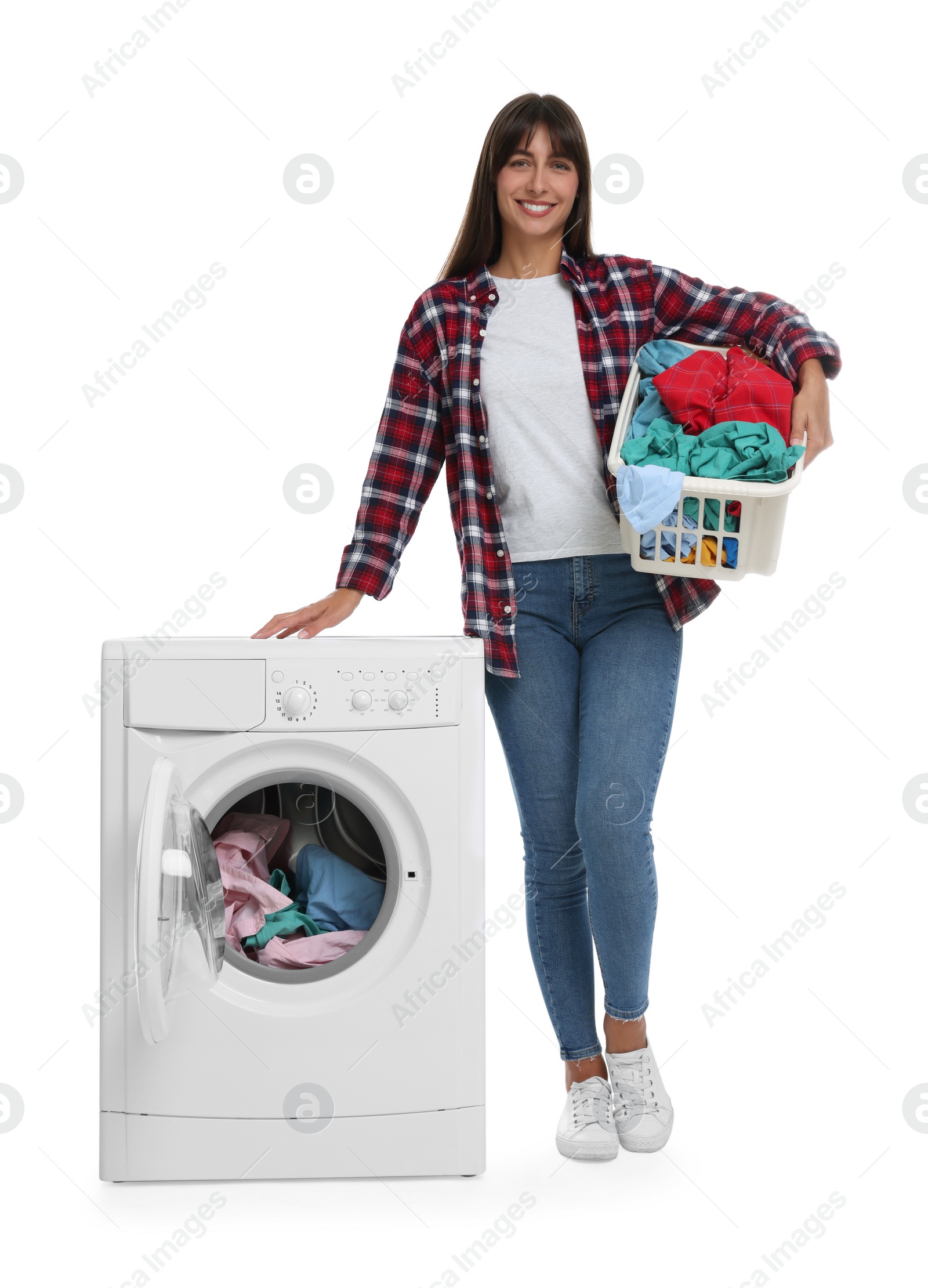 Photo of Beautiful woman with laundry basket near washing machine on white background