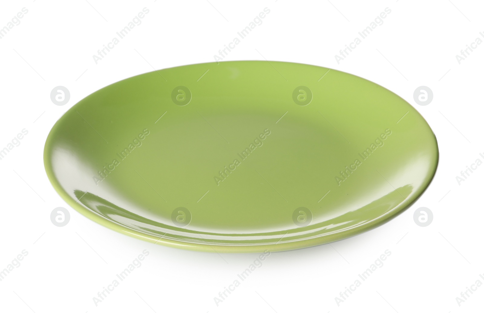 Photo of One green ceramic plate isolated on white