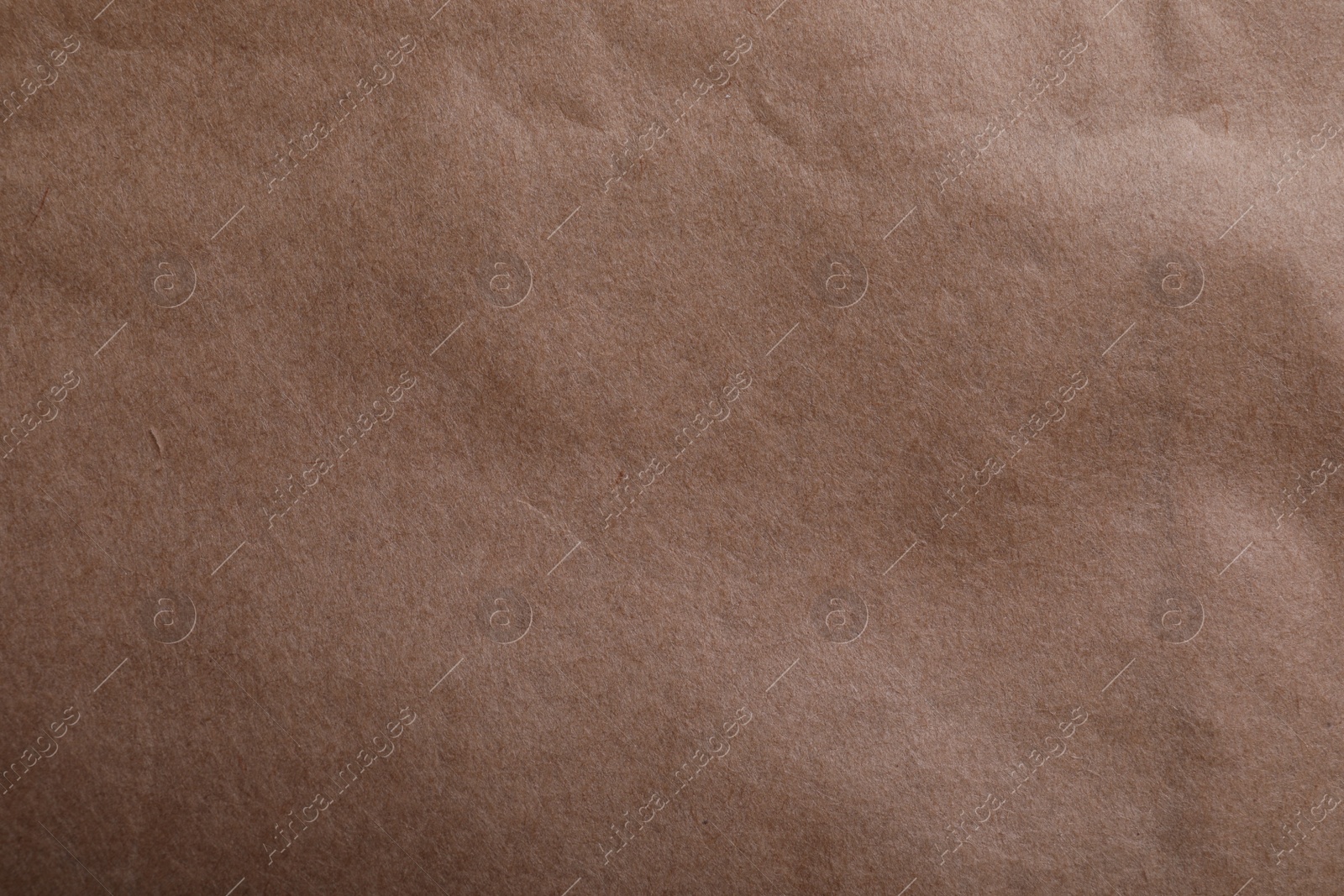 Photo of Texture of kraft paper bag as background, closeup