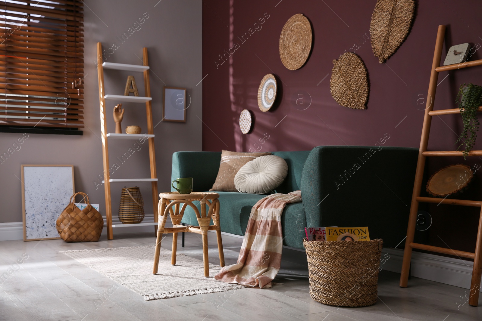 Photo of Comfortable wooden stool near sofa in living room