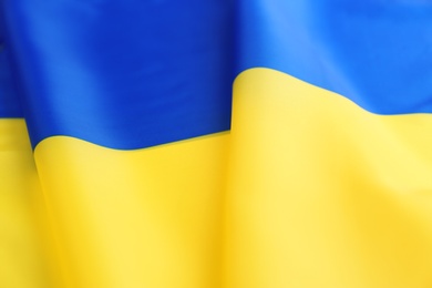 Photo of National flag of Ukraine as background, closeup
