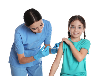 Doctor vaccinating little child on white background