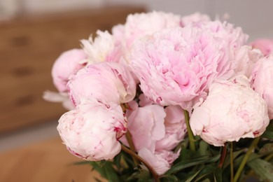 Photo of Beautiful pink peonies on blurred background, closeup