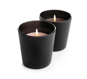 Photo of Aromatic burning candles in black holders isolated on white