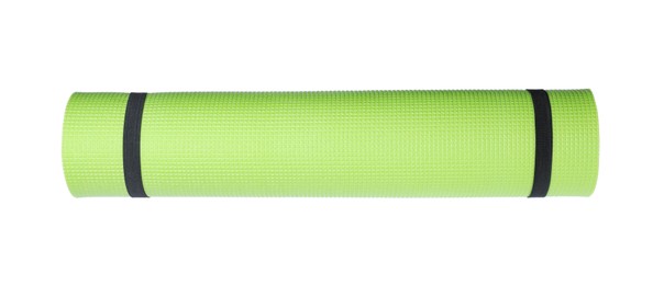Photo of Light green rolled camping or exercise mat on white background, top view