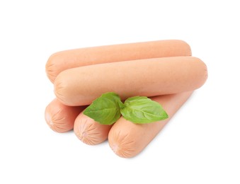 Photo of Many delicious boiled sausages and basil on white background