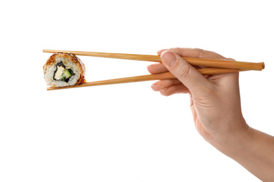 Woman holding sushi roll on white background, closeup