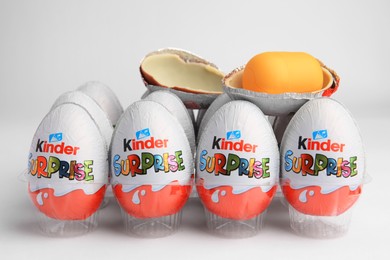 Sveti Vlas, Bulgaria - June 26, 2023: Kinder Surprise Eggs and capsule with toy in plastic tray on white background