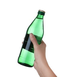 Woman holding glass bottle with water on white background, closeup