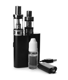Photo of Electronic smoking devices, vaping liquid and charger on white background