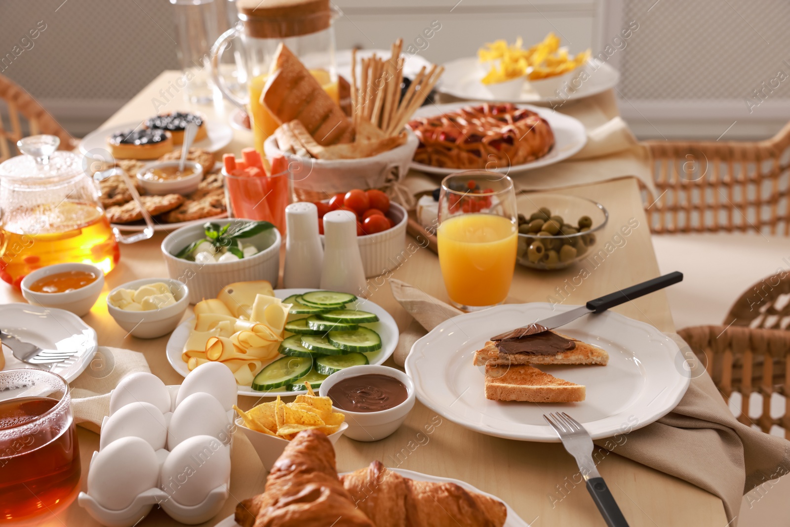 Photo of Dishes with different food on table indoors. Luxury brunch