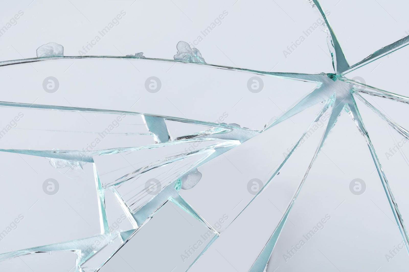 Photo of Shards of broken mirror on white background, top view