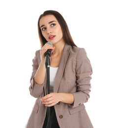 Photo of Young stylish woman in jacket posing with microphone on white background