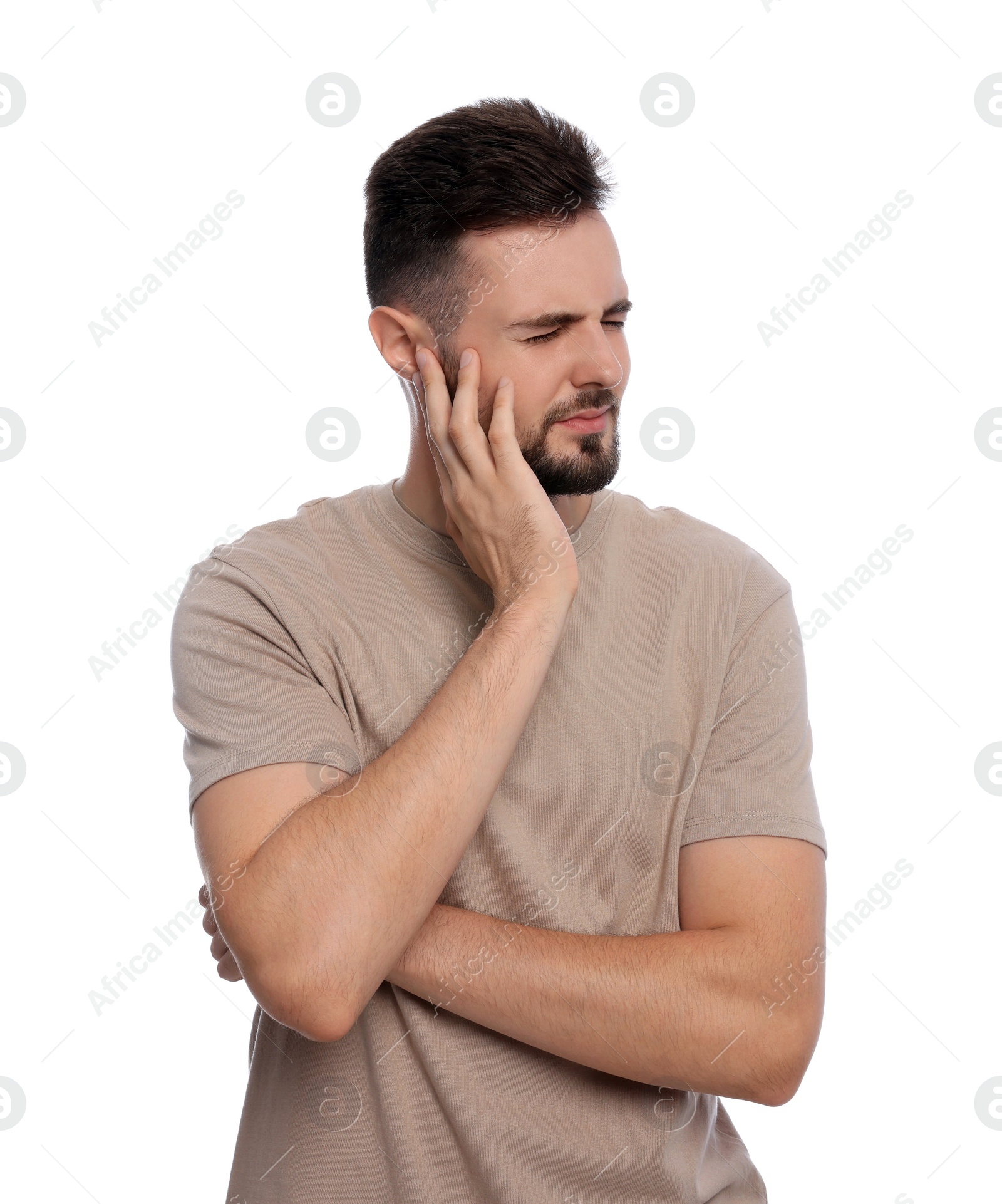 Photo of Young man suffering from ear pain on white background