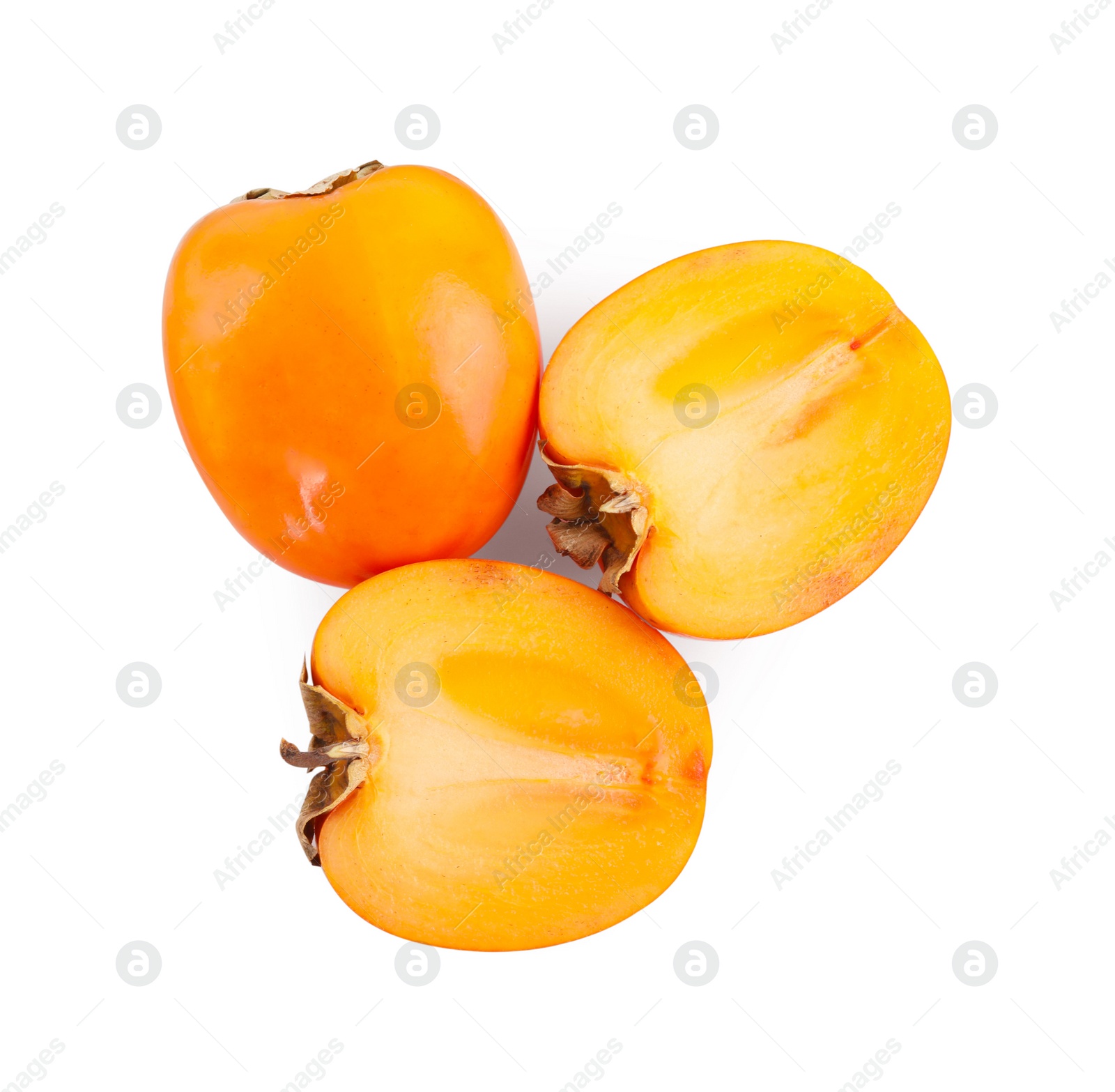 Photo of Whole and cut persimmon fruits isolated on white, top view