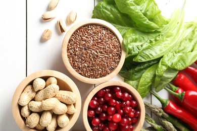 Many different healthy food on white wooden table, flat lay