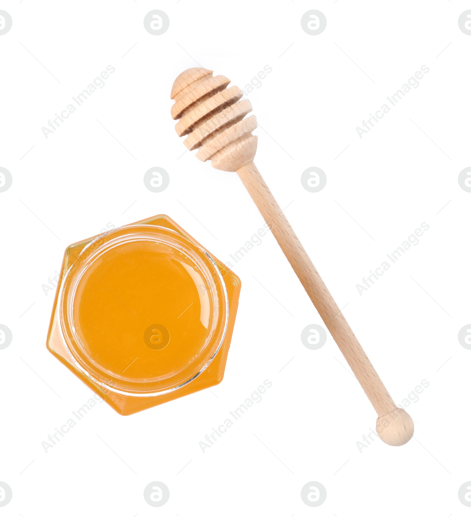 Photo of Tasty honey in glass jar and dipper isolated on white, top view