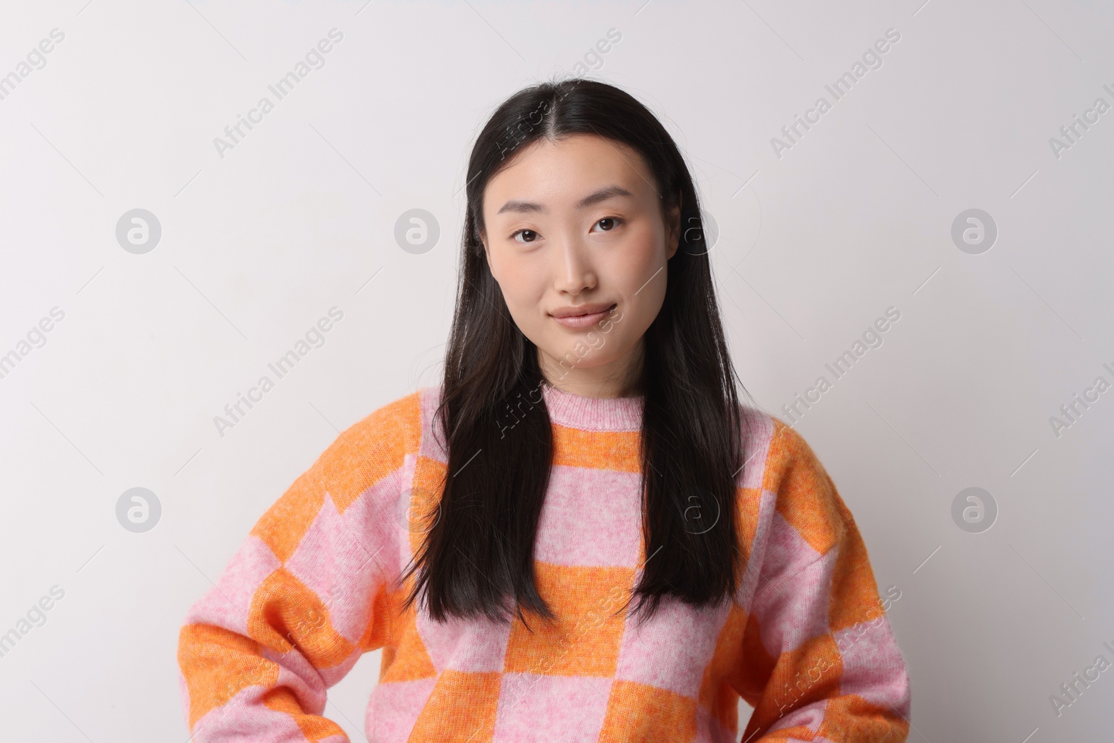 Photo of Portrait of beautiful woman on light background