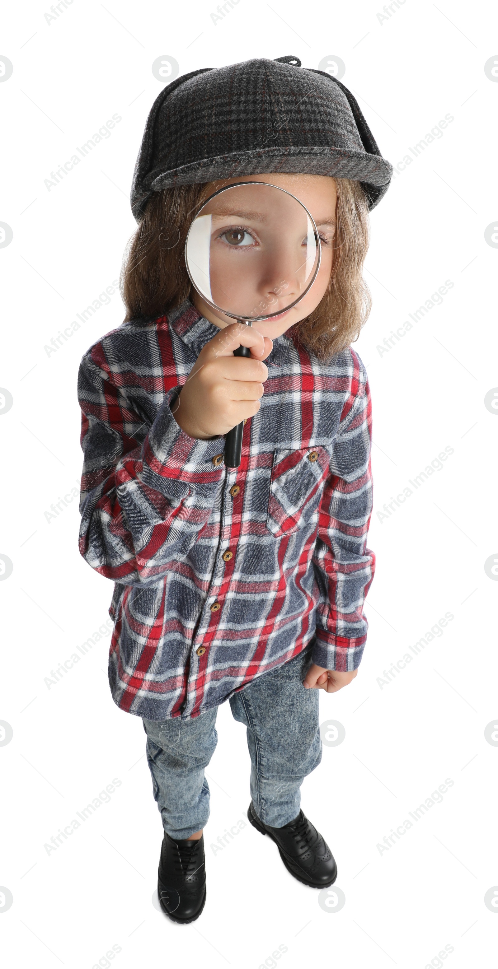 Photo of Cute little child in hat with magnifying glass playing detective on white background