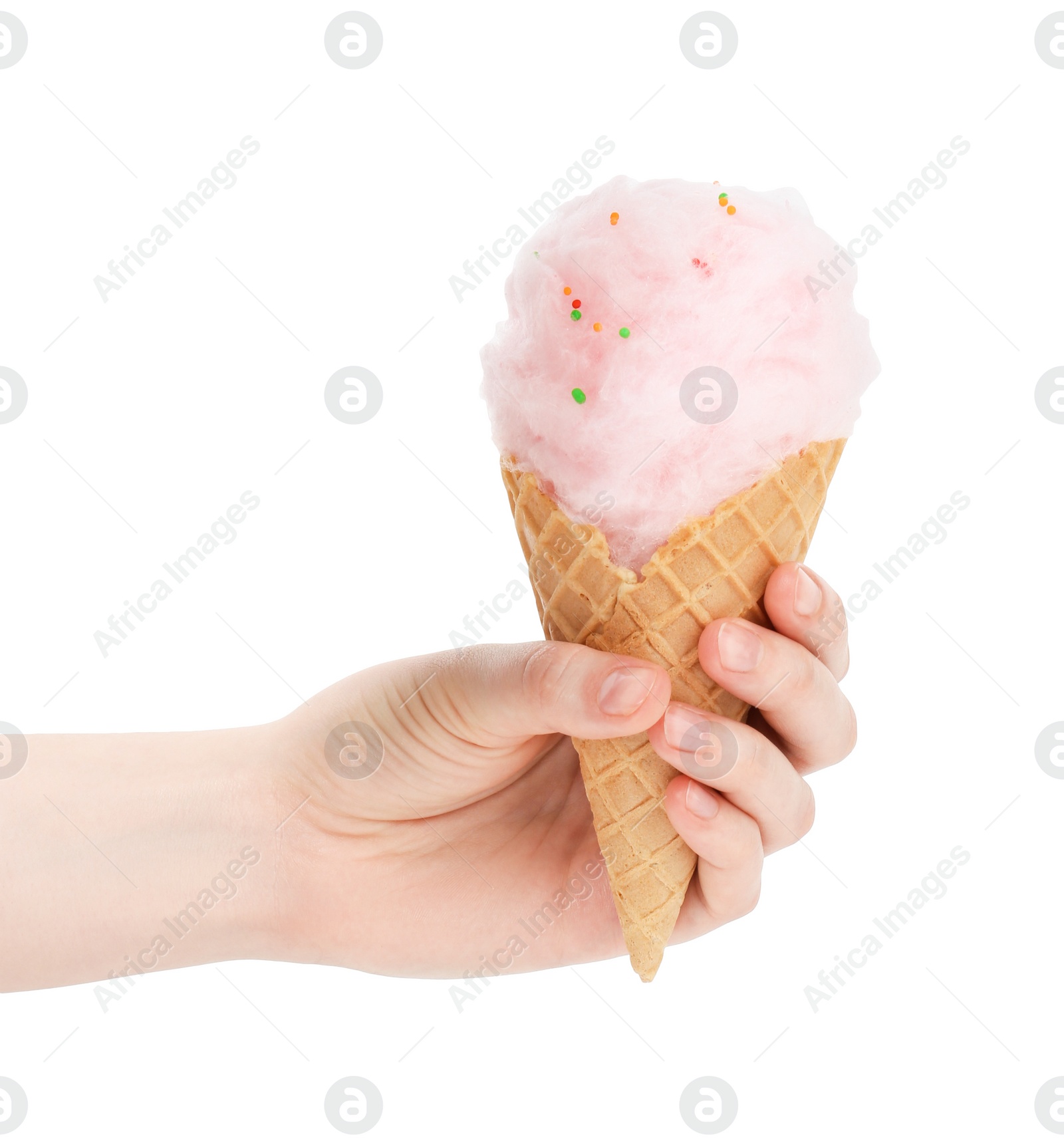 Photo of Woman holding waffle cone with cotton candy on white background, closeup