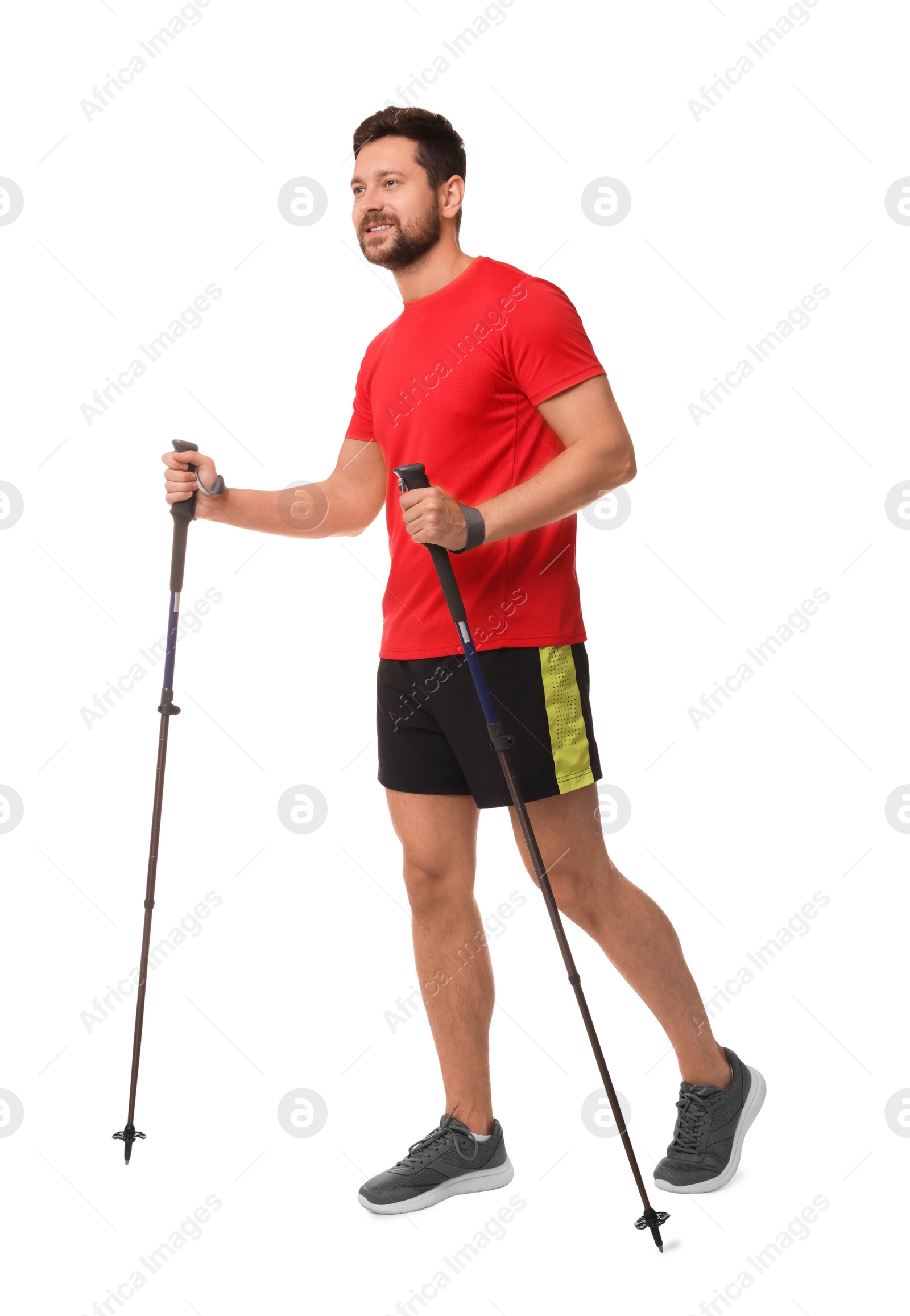 Photo of Man practicing Nordic walking with poles isolated on white