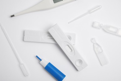 Photo of Disposable express test kit for hepatitis on white background, flat lay