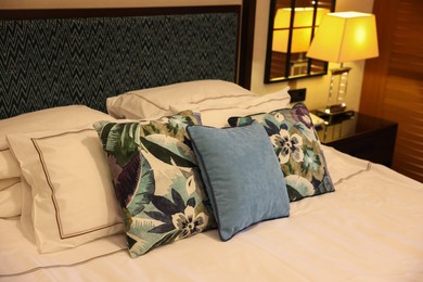 Beautiful pillows on bed in hotel room